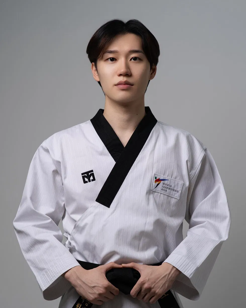 Master Cho, head instructor at Hyun Mu Taekwondo, in a black-belt dobok.