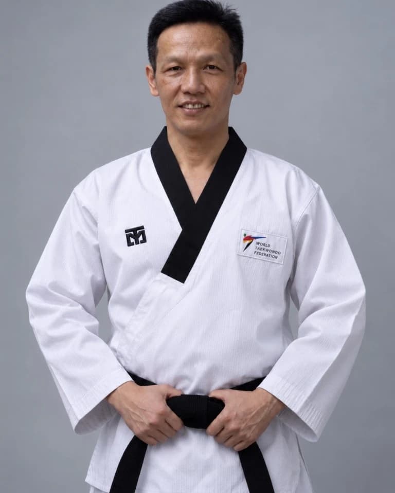 Grand Master Darren Lee at Hyun Mu Taekwondo, in a black-belt dobok.